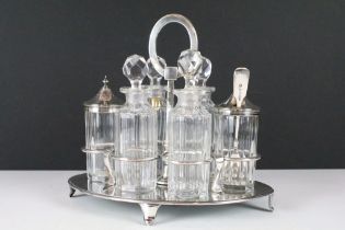 A cut glass and silver plate six piece condiment set.