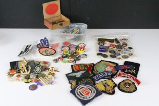 A collection of mixed button, enamel and cloth badges to include music, military, association and