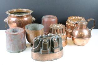 Selection of Victorian copper jelly moulds together with a twin handled pot and lidded jug. round