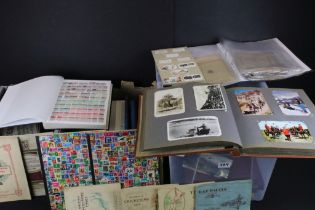 Collection of stamps and cigarette cards across three boxes to include an album of definitives