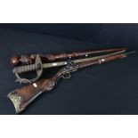 Reproduction non firing French flint lock musket together with a reproduction sword and carved