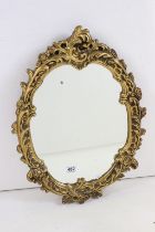 20th century Plaster Gilt Framed Oval Mirror in the Rococo style, 47cm x 62cm