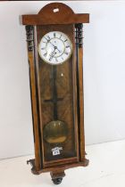 19th century Walnut and Ebonised Cased Hanging Wall Clock, the white enamel face with Roman numerals