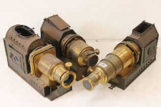 Three late 19th century tinplate & gilt metal magic lantern projectors to include two Riley Bros