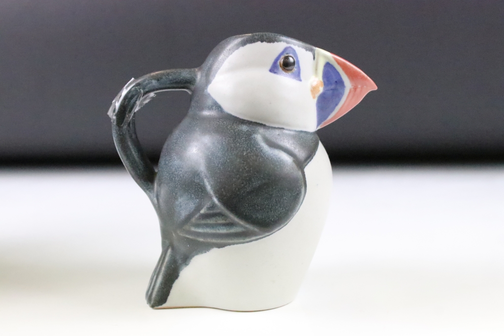 Three graduating John O'Groats pottery puffin jugs. Each moulded into the form of a puffin with hand - Image 6 of 12