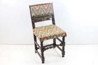 17th century style Carved Oak Chair raised on turned and block legs with barley-twist front