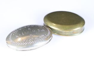 Two antique metal snuff boxes, one marked Thomas P. Jones 1907 Nantgarw. to the lid.