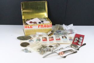 A box of mixed collectables to include buttons, badges, cigarette lighter, watch, costume