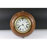 Carved wood & brass nautical ships clock, the white enamel dial with Roman numerals, poker style