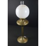 19th Century Victorian brass oil lamp having a reeded column base with white glass orb shade.