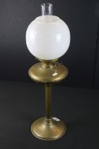 19th Century Victorian brass oil lamp having a reeded column base with white glass orb shade.