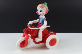 Vintage Russian Pinocchio trike plastic push-along toy, approx 30cm high