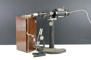 C Baker London electric microscope together with a desk top mirror microscope set within a wooden