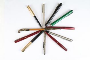 A collection of pens and pencils to include Parker fountain pens and sterling silver propelling