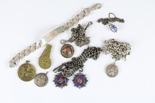 A small collection of sterling silver jewellery to include albert chain, watch fobs, pendants and