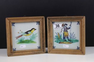 Pair of Delft tiles to include one featuring a soldier and another featuring a bird. Both framed.