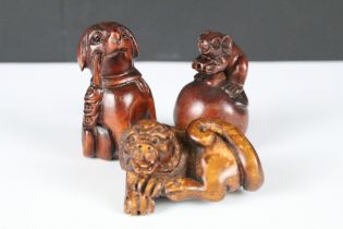 Japanese Signed Wooden Netsuke in the form of a Dog, Japanese Wooden Netsuke in the form of a Rat on