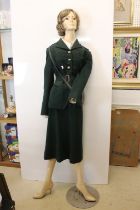 Full size female mannequin, painted and clothed in WW2 military dress, with RWCA collar badge,