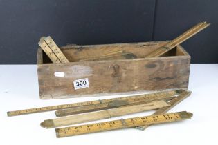 A collection of sixteen vintage wooden folding rulers to include Rabone examples