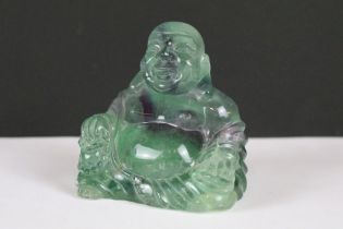 A hand craved fluorite ornamental buddha, stands approx 7cm in height.