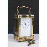 A French made gilt brass cased carriage clock with bevelled glass panels, complete with key.