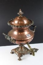 Victorian copper samovar / tea urn, with cover, twin scroll handles, brass tap, raised on four feet.