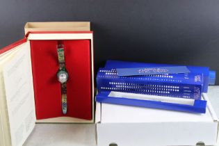 Two swatch watches to include the 1999 Swatch club watch and the limited edition Christmas magic