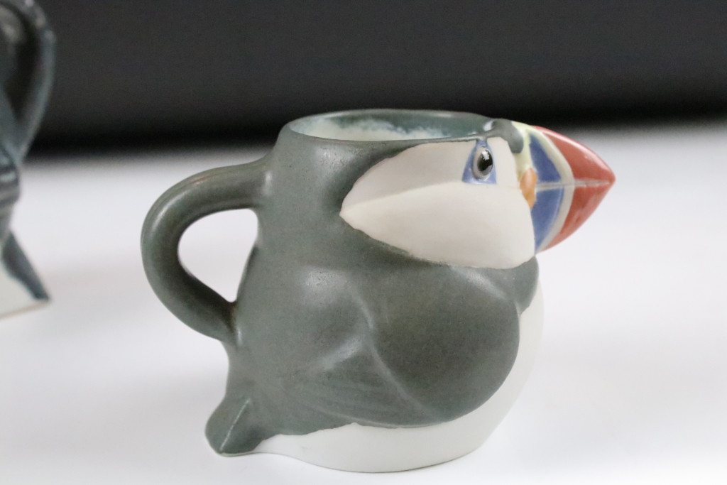 Three graduating John O'Groats pottery puffin jugs. Each moulded into the form of a puffin with hand - Image 11 of 12