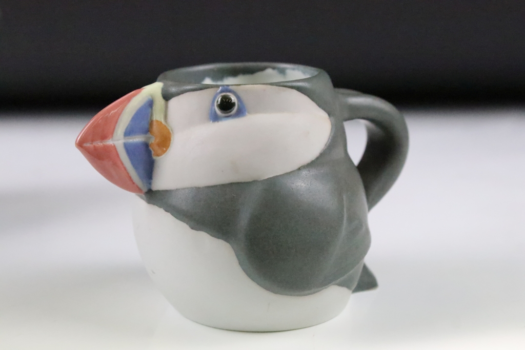 Three graduating John O'Groats pottery puffin jugs. Each moulded into the form of a puffin with hand - Image 10 of 12