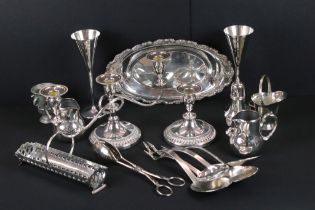 A collection of mixed silver plate to include candlesticks, goblets, trays, cutlery, sugar