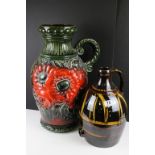 Large West German pottery vase with moulded floral decoration on a green ground (54.5cm high),