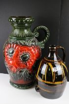 Large West German pottery vase with moulded floral decoration on a green ground (54.5cm high),