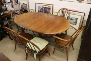 Ercol Oval Extending Dining Table, 165cm long x 107cm wide x 75cm high together with a set of Six