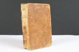 An 18th century leather bound book titled 'The Economy of Human Life', dated 1795.