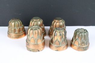 A collection of six antique copper jelly moulds