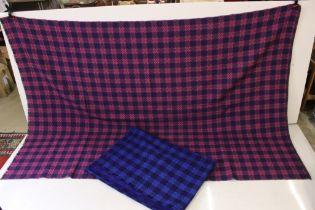 Two Welsh woollen blankets with fringed edges, of chequered design, one in a green, pink & purple