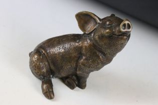 Bronze figure of a seated pig, approx 14.5cm high