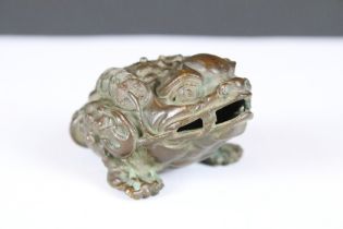 A Chinese lucky Jin Chan ornamental money toad bronze rattling figure.