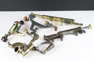 A collection of vintage shotgun cartridge loading equipment.