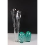Two control bubble end of day glass paperweights together with a clear art glass vessel with control