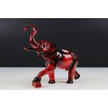 Peggy Davies flambe elephant ceramic figurine, modelled with trunk raised. Printed marks to