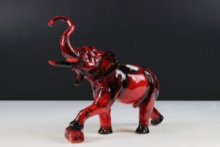 Peggy Davies flambe elephant ceramic figurine, modelled with trunk raised. Printed marks to