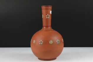 19th Century Victorian Watcombe terracotta and enamel bottle vase being decorated with floral enamel