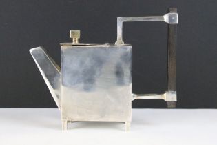 A silver plated teapot in the style of Christopher Dresser.