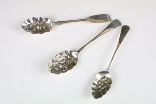 A collection of three fully hallmarked sterling silver berry spoons.