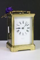 A brass cased carriage clock with bevelled glass panels, retail marked for Joseph Gacph of