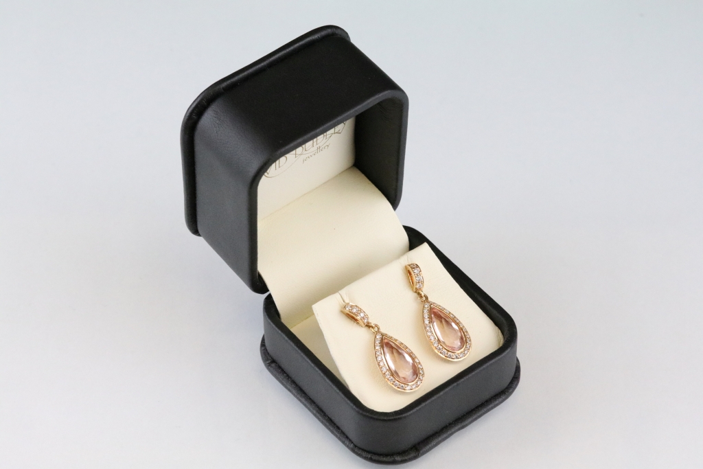 Pair of morganite and diamond 18ct rose gold drop earrings, the pear shaped mixed cut morganite