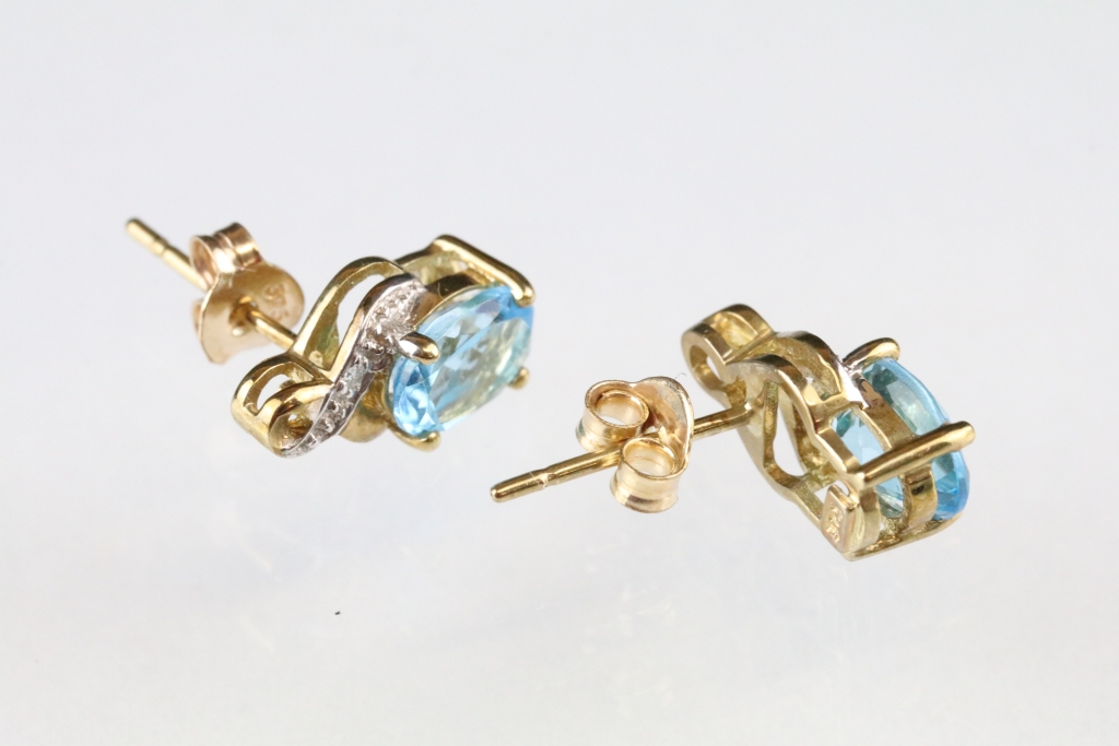 Pair of topaz and diamond 9ct yellow and white gold set stud earrings, the oval mixed cut blue topaz - Image 3 of 3