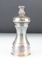 Silver pepper grinder, plain polished baluster form with cast pineapple finial, makers BD, Sheffield