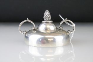 Edwardian early 20th Century silver hallmarked table lighter having twin scrolled handles with